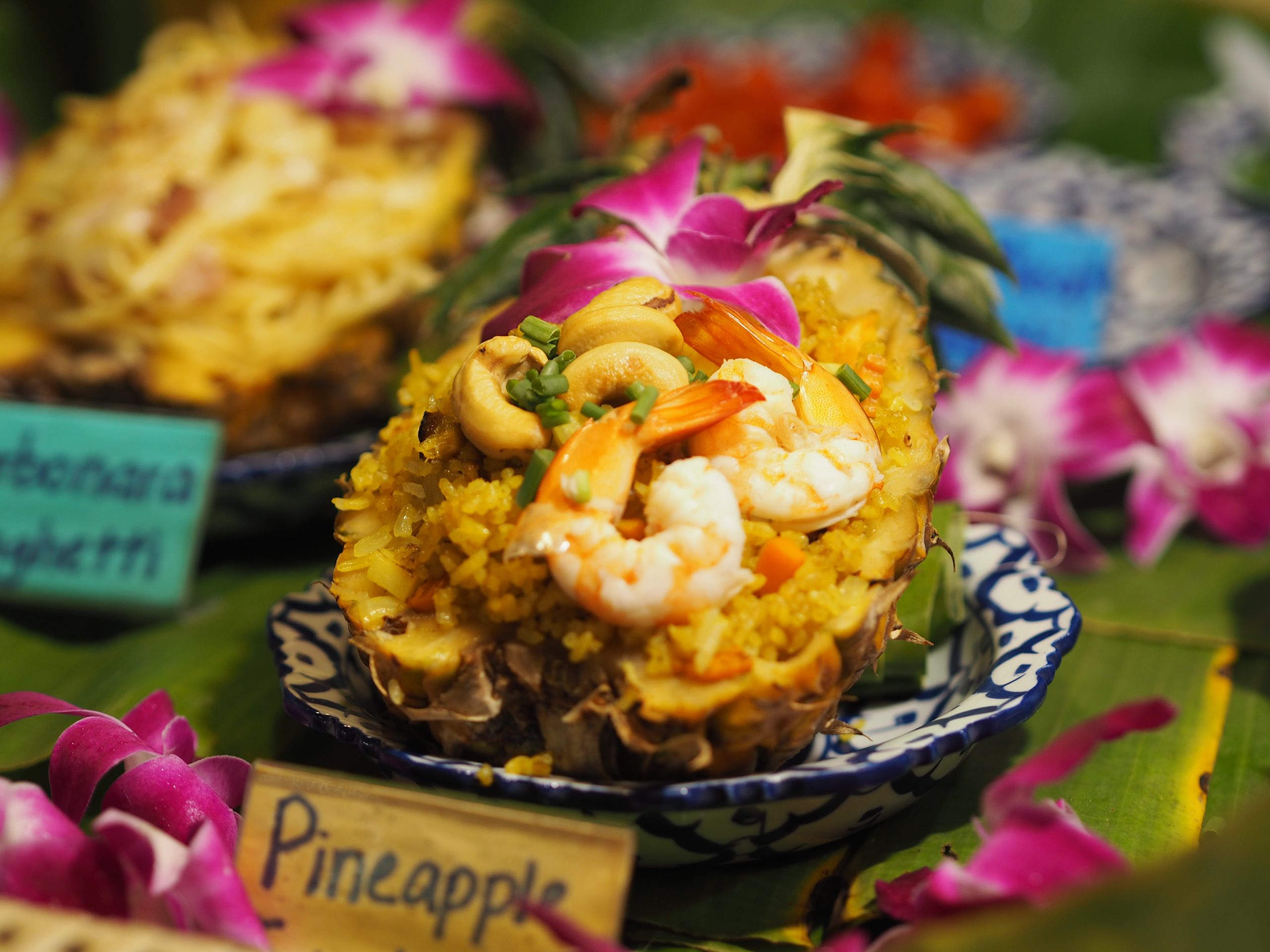 pineapple-boat-dish-garnished-with-orchid-flowers-2026-01-08-08-22-29-utc